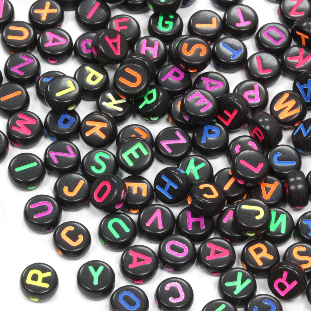 Flat round plastic black beads with coloured mix of letters 